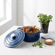 סיר יציקת ברזל 24X11.5 ס"מ HERITAGE STARRY SKY | Surround the cookware with light, airy styling props in the same clean, minimal, natural-light mood as "Visual Reference 1" — choose 1-2 simple elements such as
