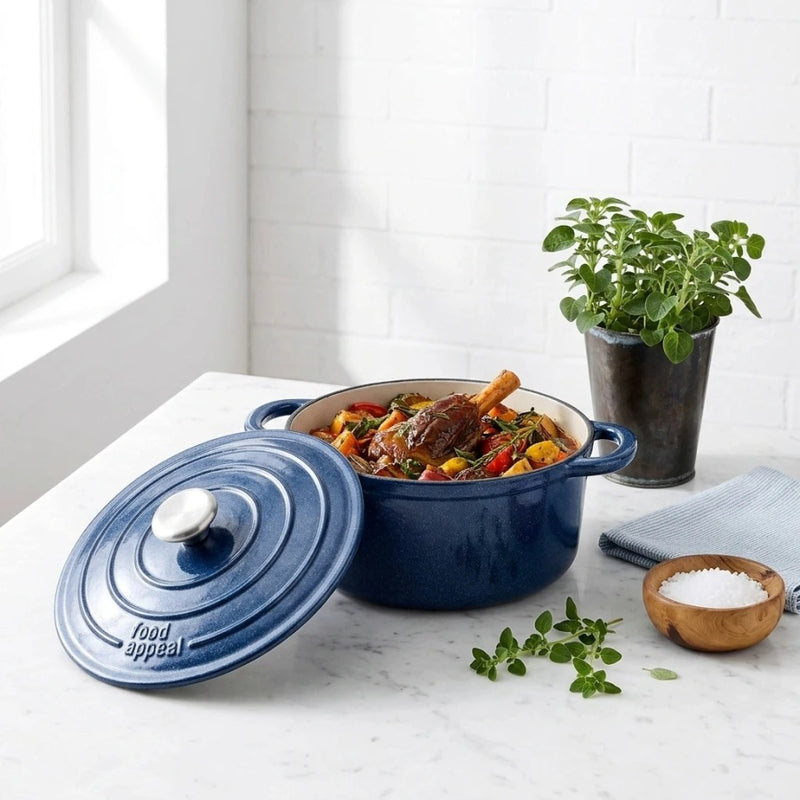 סיר יציקת ברזל 24X11.5 ס"מ HERITAGE STARRY SKY | Surround the cookware with light, airy styling props in the same clean, minimal, natural-light mood as "Visual Reference 1" — choose 1-2 simple elements such as