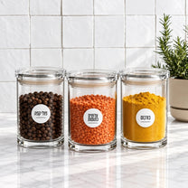 סט 3 אחסוניות עגולות אקרילי 850 מ"ל CLEAR & FRESH | Create a premium eye-level lifestyle product photograph by placing the storage canisters from the source image into the scene from @visual reference 2.
